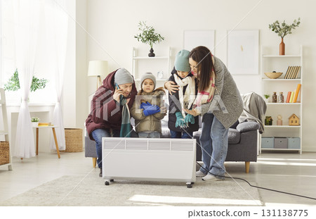 Family feeling cold at home trying to solve problem with heating 131138775