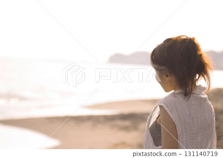 Shonan Coast - A woman on the beach at dusk 131140719