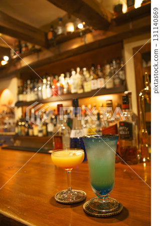 A couple tasting drinks in an authentic bar A couple tasting drinks in an authentic bar 131140869