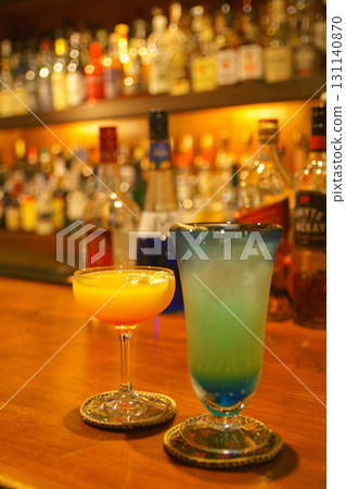 A couple tasting drinks in an authentic bar 131140870