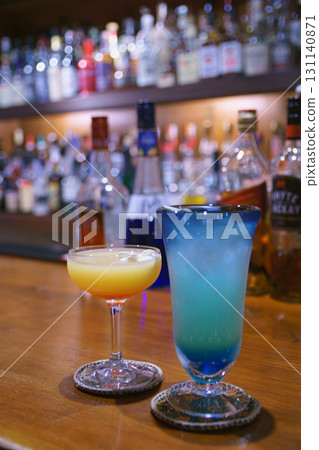 Couple enjoying cocktails at an authentic bar 131140871