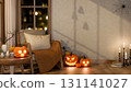 Wooden chair and lighting candle on table and carved jack-o-lantern halloween pumpkin and spider web 131141027