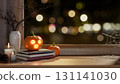 Glowing jack-o-lantern halloween pumpkin and candles with spider web on table aside window at night. 131141030