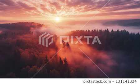 A breathtaking sunrise over a misty forest, painted in hues of orange and pink. 131141324