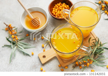 Sea buckthorn hot drink with honey promoting wellness Sea buckthorn hot drink with honey promoting wellness 131142031