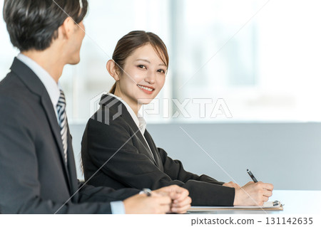 Businesswomen receiving training, seminars, and coaching and their instructors 131142635