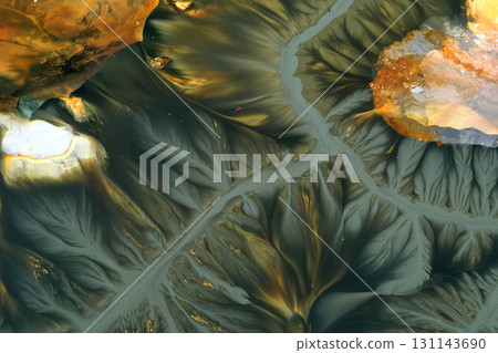 Flying over surreal patterns of flowing colorful mining chemical residuals aerial Flying over surreal patterns of flowing colorful mining chemical residuals aerial 131143690