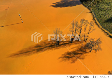 Flying over surreal patterns of flowing colorful mining chemical residuals aerial 131143693