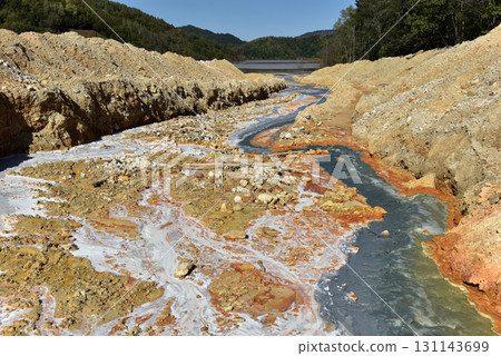 Toxic gold mining residual waters from gold mine flowing and polluting environment Toxic gold mining residual waters from gold mine flowing and polluting environment 131143699