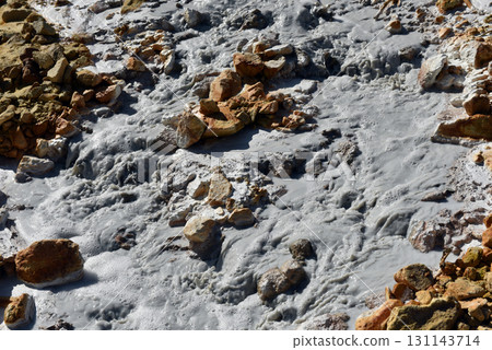 Acidic mine residual water drainage, flowing into decanting pond 131143714