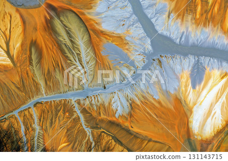 Flying over surreal patterns of flowing colorful mining chemical residuals aerial Flying over surreal patterns of flowing colorful mining chemical residuals aerial 131143715