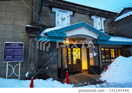 Winter in Otaru, Hokkaido: Rurikobo on Sakaimachi Main Street at dusk 131145448