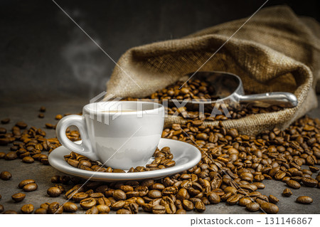 Steaming cup coffee roasted beans Steaming cup coffee roasted beans 131146867