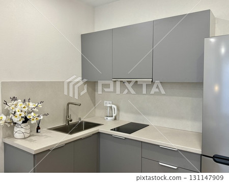 new stylish kitchen set in a modern apartment interior 131147909