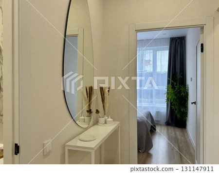 Women's white dressing table in a modern and stylish interior Women's white dressing table in a modern and stylish interior 131147911
