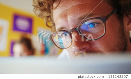 HR manager observes as a young man fills out a digital feedback survey on a laptop in a spacious office with natural wood textures. Survey research answer checklist 131148207