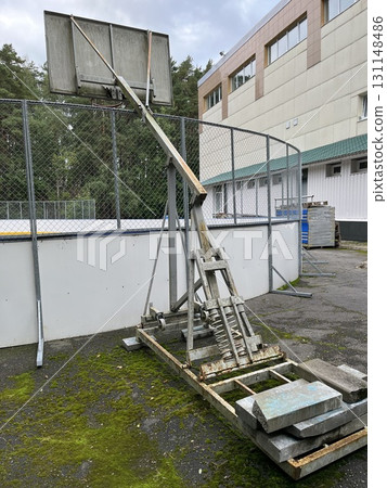 Abandoned portable basketball hoop showing decay and neglect 131148486