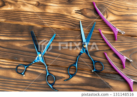 Hairdressing tools for cutting hair on wooden background Hairdressing tools for cutting hair on wooden background 131148516
