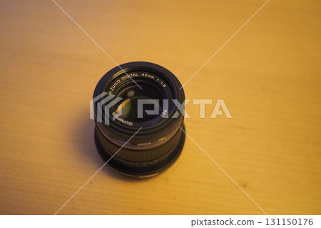 M.ZUIKO 45mm F1.8 prime lens placed on the table 131150176