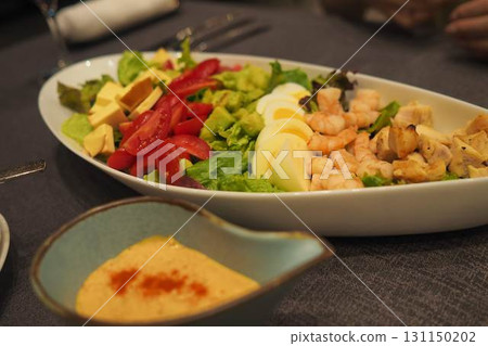 Shrimp and avocado sharing style Cobb salad 131150202