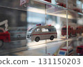 A miniature ambulance displayed in a diorama collection case 131150203