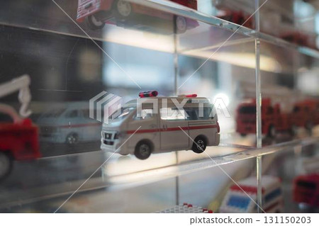 A miniature ambulance displayed in a diorama collection case A miniature ambulance displayed in a diorama collection case 131150203