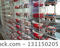 Fire engines and ambulances made from blocks lined up in an acrylic case 131150205