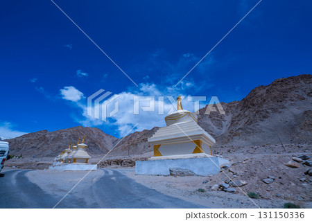 Himalayan Buddhist Stupas by Mountain Road 131150336