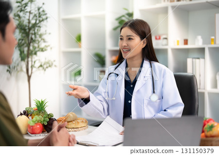 Patient Interaction: Doctor Explaining Nutrition and Health Choices 131150379