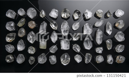 A row of white crystals on a black background 131150421
