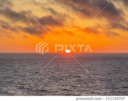 The sun setting over the sea and the red sunset sky 131150707