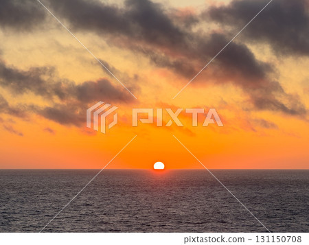 The sun setting over the sea and the red sunset sky The sun setting over the sea and the red sunset sky 131150708