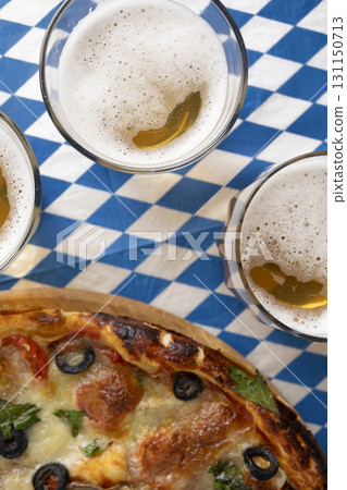 Oktoberfest Celebration with Beer Glasses and Pizza 131150713