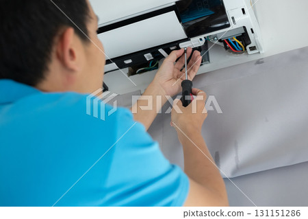 Electrician man repair and maintenance air conditioner Electrician man repair and maintenance air conditioner 131151286