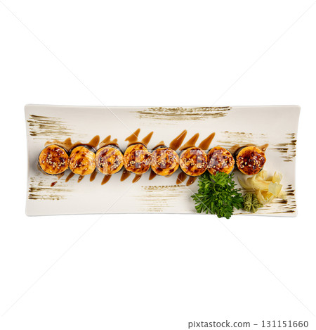 Isolated baked sushi rolls with sauce on plate Isolated baked sushi rolls with sauce on plate 131151660