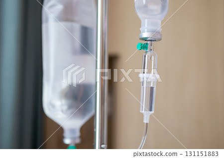 Close up medical intravenous IV drip in hospital background Close up medical intravenous IV drip in hospital background 131151883