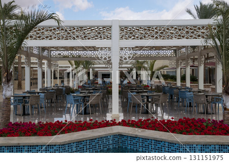 a large space with blue chairs and tables a large space with blue chairs and tables 131151975