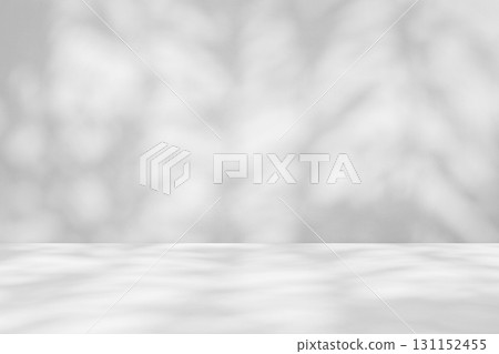 Abstract white studio room with light and shadow from tree leaves background for product display presentation Abstract white studio room with light and shadow from tree leaves background for product display presentation 131152455