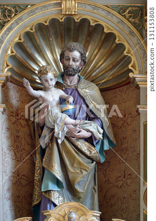 Saint Joseph holding child Jeaua, statue on the altar of Saint Joseph in the church of Our Lady of Lourdes and St. Joseph in the Barilovicki Leskovac, Croatia 131153808