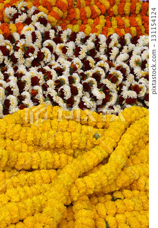 Flowers and garlands for sale at the flower market in Kolkata, West Bengal, India Flowers and garlands for sale at the flower market in Kolkata, West Bengal, India 131154124