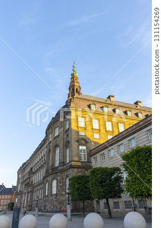 Copenhagen, Denmark - June 15,2022 : View of Christiansborg palace, famous landmark of danish capital, Copenhagen, Denmark on June 15, 2022. Copenhagen, Denmark - June 15,2022 : View of Christiansborg palace, famous landmark of danish capital, Copenhagen, Denmark on June 15, 2022. 131154269