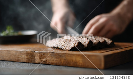 Sliced beef steak on wooden cutting board with hands preparing a delicious meat dish concept Sliced beef steak on wooden cutting board with hands preparing a delicious meat dish concept 131154528