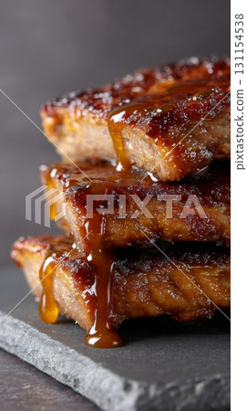 Juicy grilled meat stacked on slate plate showcasing rich texture and flavor concept meat is back Juicy grilled meat stacked on slate plate showcasing rich texture and flavor concept meat is back 131154538