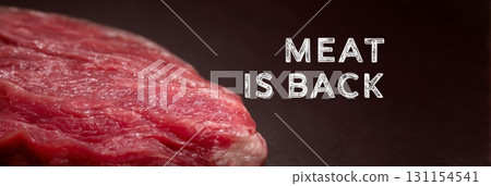 Fresh raw meat cut on dark background, emphasizing the return of meat in modern cuisine 131154541