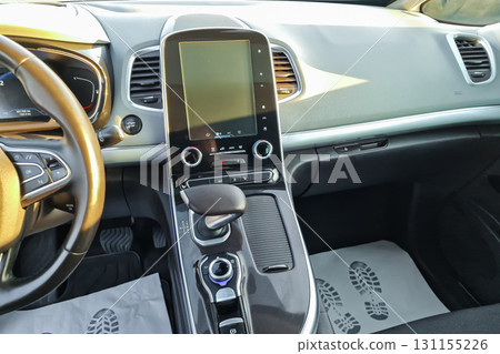 Experience the modern interior of a sleek car showcasing advanced technology and a spacious design for comfortable journeys 131155226