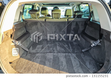 Empty spacious rear cargo area of a modern SUV at a dealership during daytime 131155231