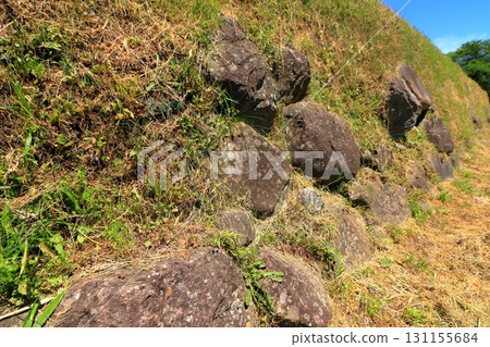Kunohe Castle ruins with stone walls and moats under the blue sky (Iwate) 131155684