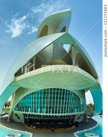 Stunning modern architecture reveals a vibrant performing arts center beneath a clear blue sky in Valencia, Spain on a sunny afternoon 131155803