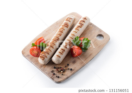 Grilled white sausages with cherry tomatoes and parsley Grilled white sausages with cherry tomatoes and parsley 131156051