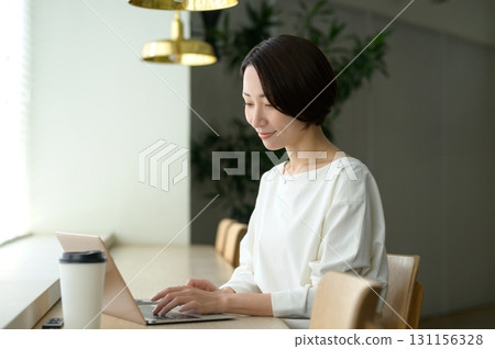 Japanese woman working by the window 131156328